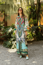 Woman in a colorful dress standing in a garden setting