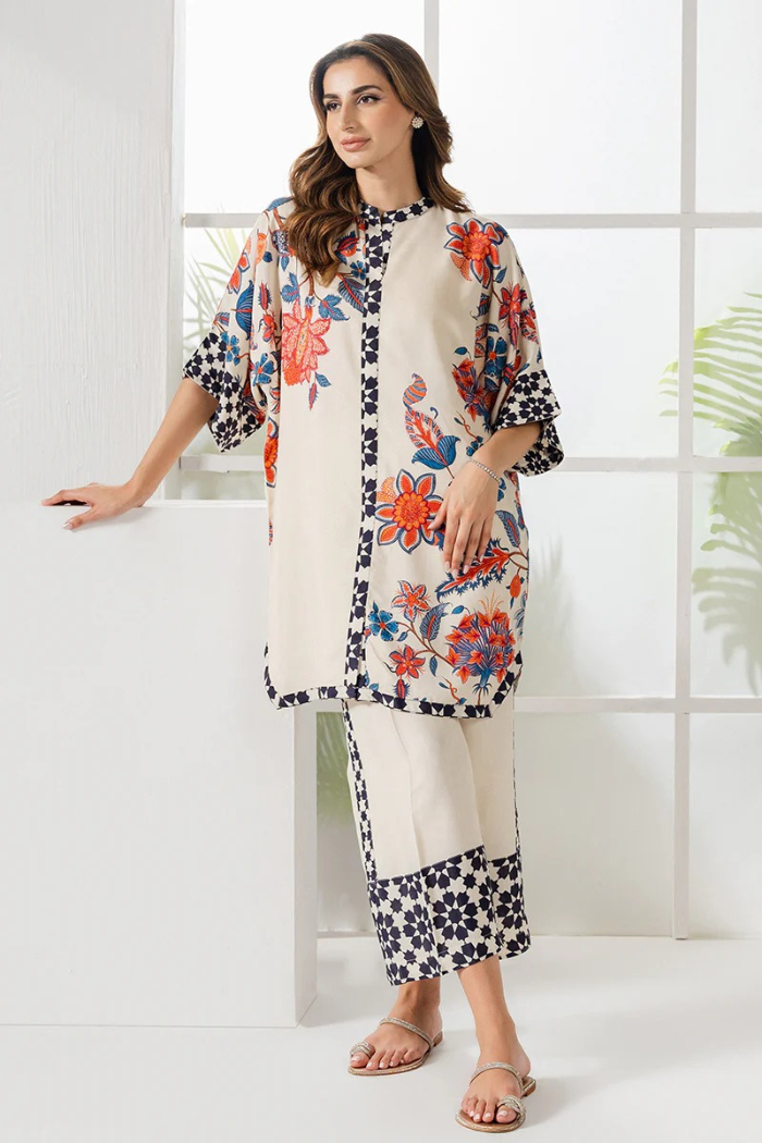 Woman wearing a floral outfit with a white background