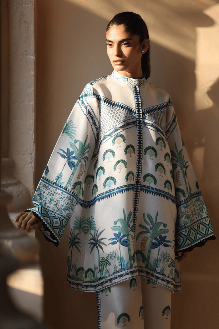 Woman wearing a patterned outfit with a beige background