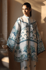 Woman wearing a patterned outfit with a beige background