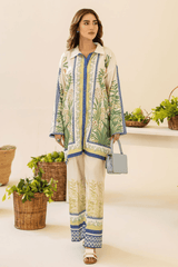 Woman wearing a patterned outfit with plants in the background