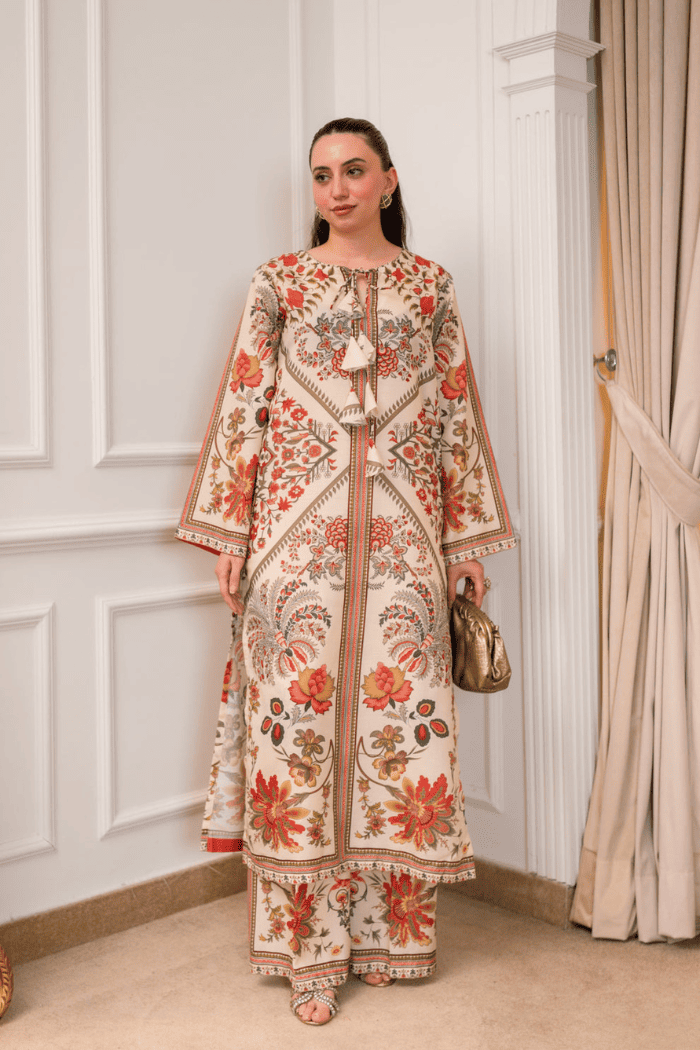 Woman wearing a floral outfit in an elegant interior setting