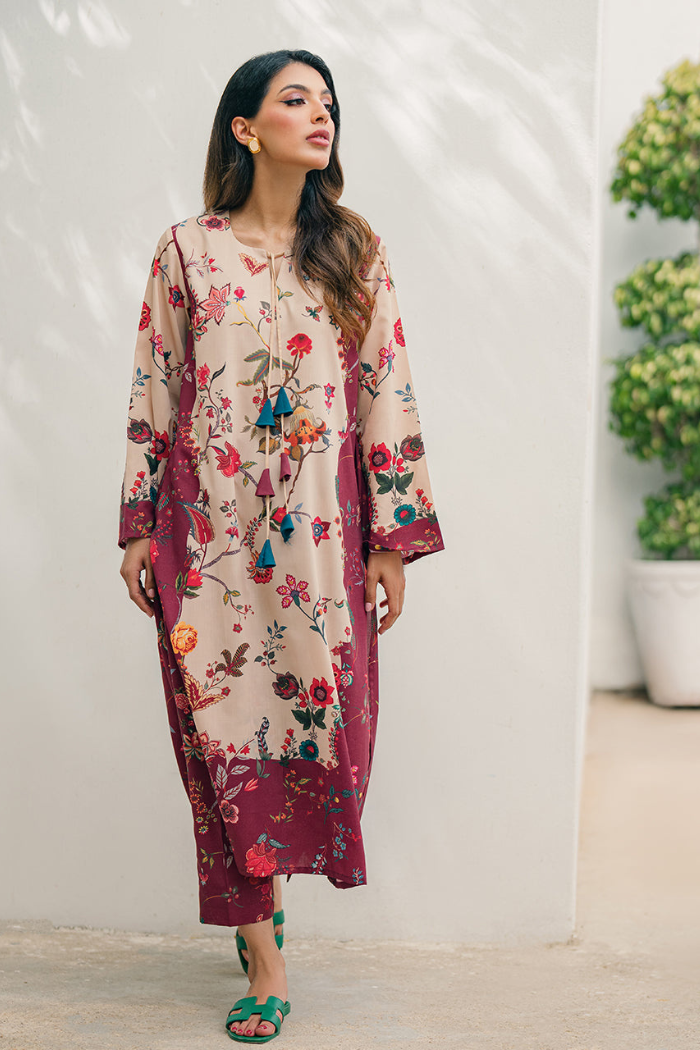 Woman wearing a floral dress with a neutral background