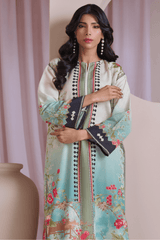 Woman wearing a floral dress with a vase in the foreground