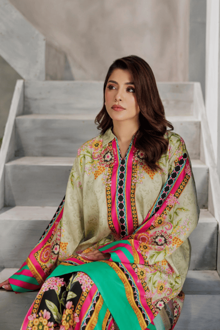 Woman in a colorful traditional outfit sitting on stairs