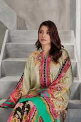 Woman in a colorful traditional outfit sitting on stairs