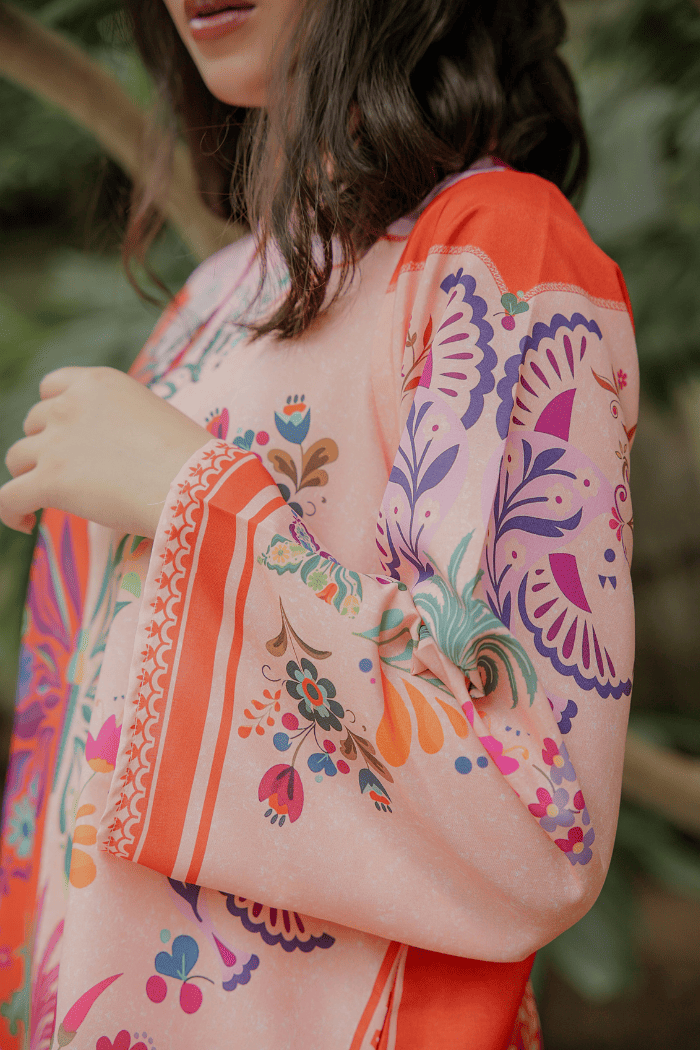 Colorful floral and abstract patterned garment with a blurred background