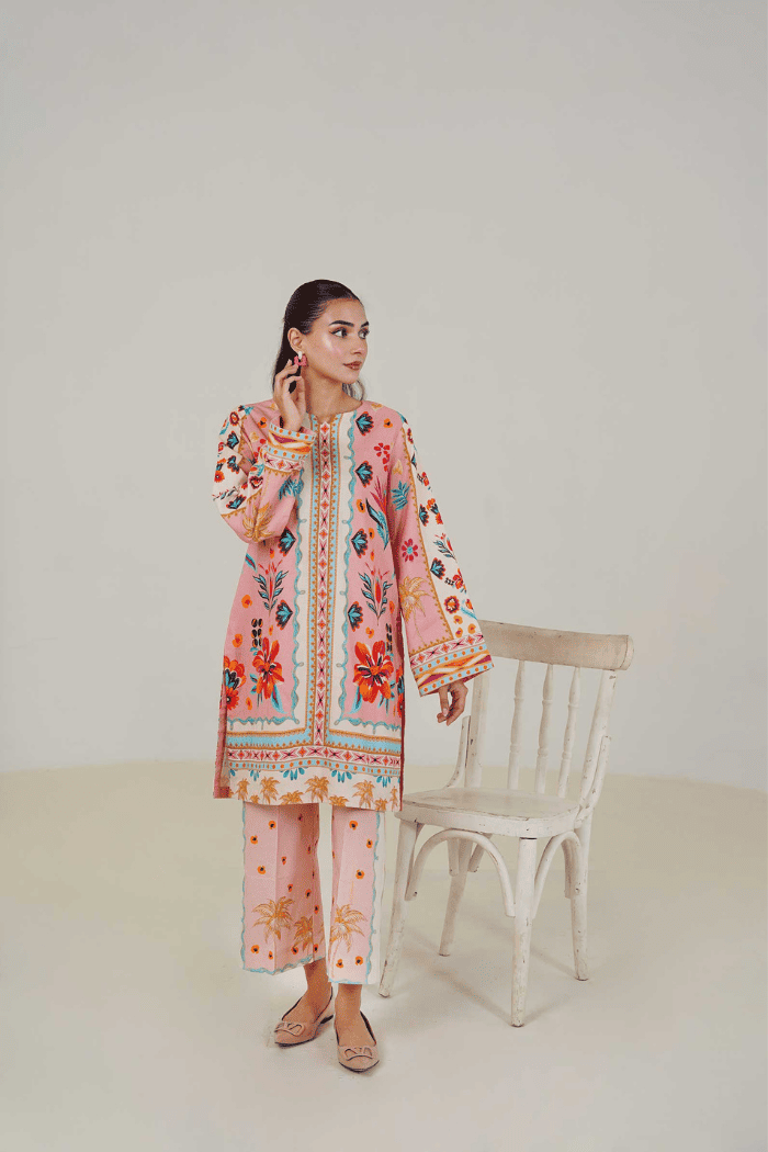Woman wearing a colorful traditional outfit with a white background