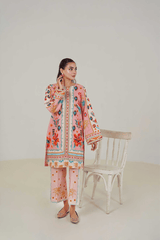 Woman wearing a colorful traditional outfit with a white background