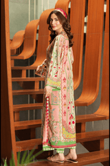 Woman in a colorful traditional outfit standing on wooden stairs.
