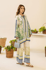 Woman in a floral outfit standing in a room with plants