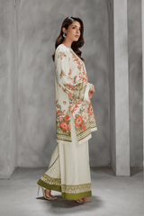 Woman wearing a floral outfit with a plain background