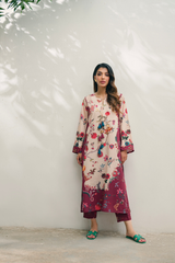 Woman wearing a floral dress with a plain white background