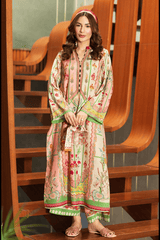Woman wearing a colorful traditional outfit sitting on a wooden staircase.
