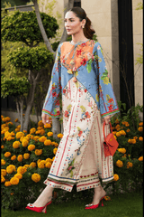 Woman in a colorful traditional outfit standing in front of flowers