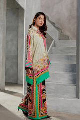 Woman in a traditional outfit with floral patterns standing on a staircase.