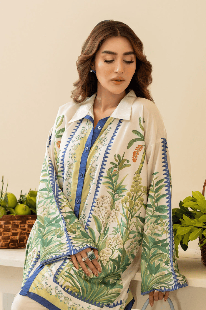 Woman wearing a floral patterned shirt with a beige background