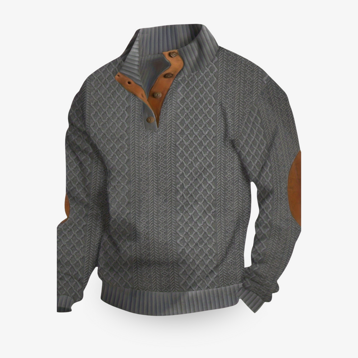 Jersey beige de punto trenzado con parches de cuero en los codos