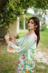 Close-up of floral prints on pastel green kurta se