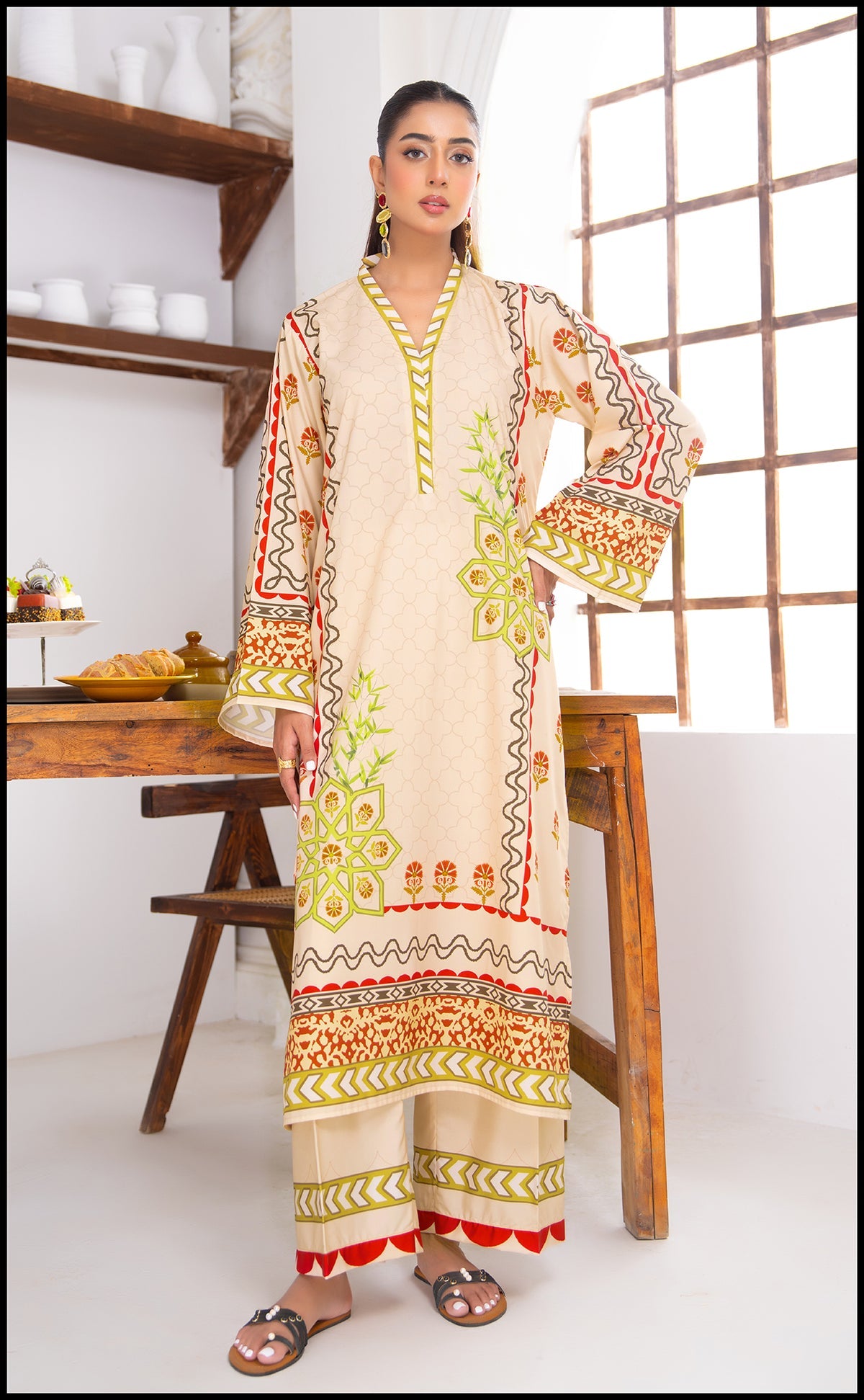 Trendy beige kurta set with maroon and green prints – festive outfit.