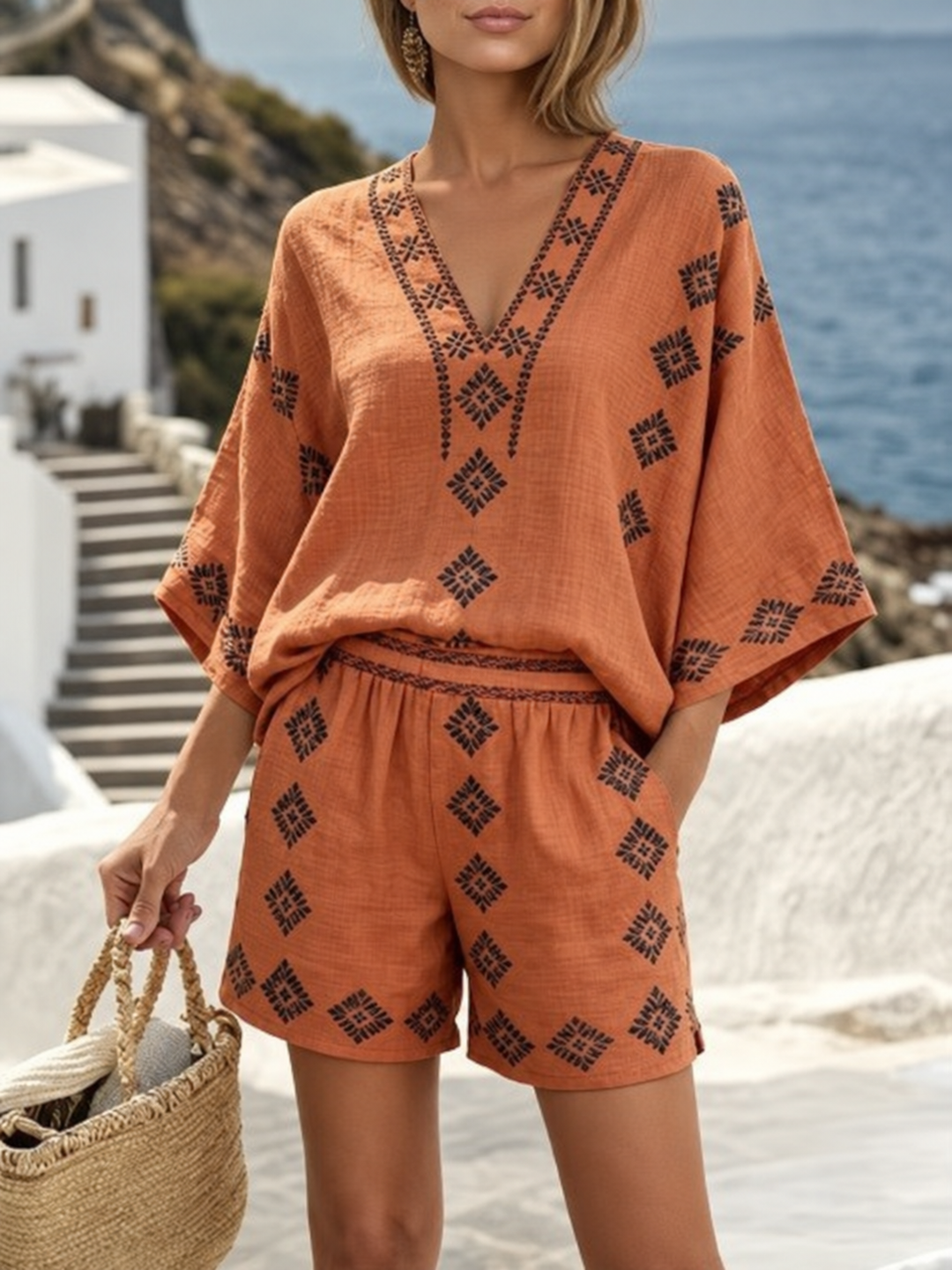 Women's relaxed orange top and shorts set with diamond embroidery and a V-neck